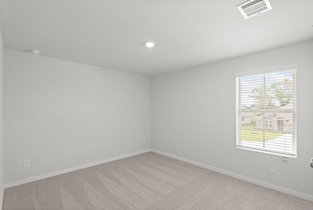 436 Shoreview Dr, Conroe, TX 77303 - empty room with light colored carpet, recessed lighting, and a smoke detector