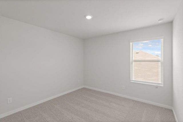 436 Shoreview Dr, Conroe, TX 77303 - spare room with light colored carpet, recessed lighting, and a smoke detector