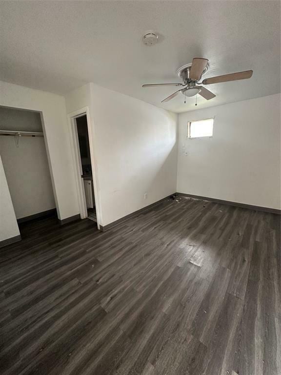 7930 Ritz St Unit 16, Houston, TX 77028 - unfurnished bedroom with dark wood finished floors, a closet, and ceiling fan