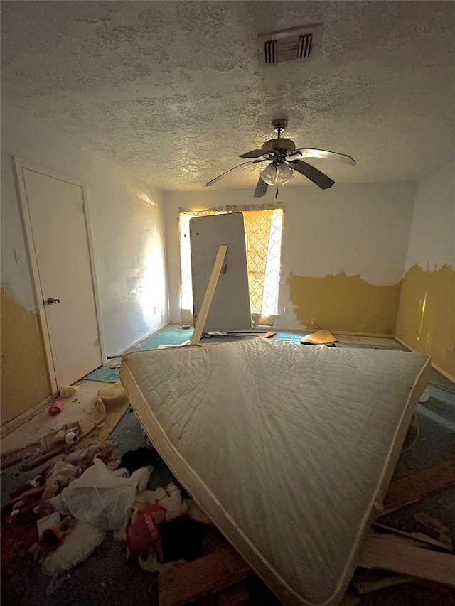 13314 N Thorntree Dr, Houston, TX 77015 - bedroom featuring a textured ceiling, a ceiling fan, and multiple windows