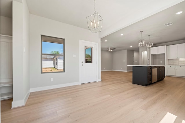 2845 14th St, Hempstead, TX 77445 - kitchen featuring open floor plan, a chandelier, recessed lighting, stainless steel dishwasher, and light countertops