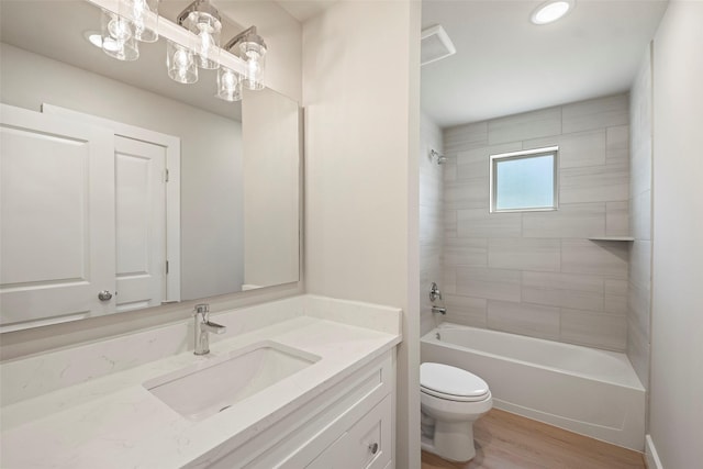 2845 14th St, Hempstead, TX 77445 - bathroom with vanity, wood finished floors, bathing tub / shower combination, and recessed lighting
