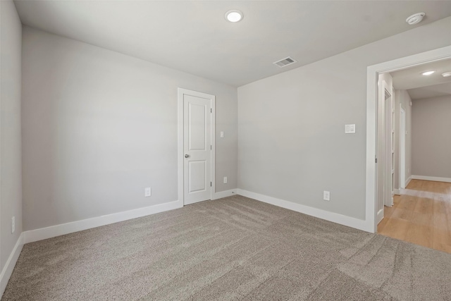 2845 14th St, Hempstead, TX 77445 - empty room featuring carpet flooring, recessed lighting, and a smoke detector