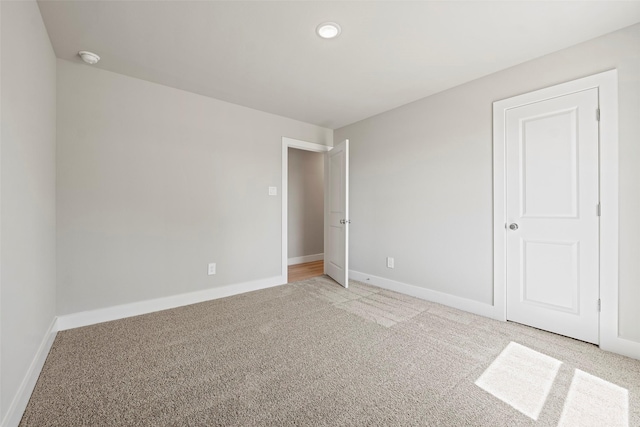 2845 14th St, Hempstead, TX 77445 - unfurnished bedroom featuring light colored carpet and recessed lighting