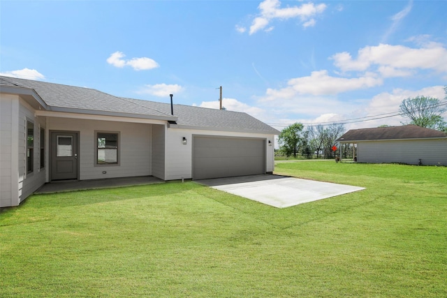 2845 14th St, Hempstead, TX 77445 - rear view of property featuring an attached garage, a lawn, roof with shingles, and concrete driveway