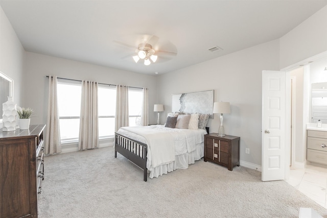 13746 Brahman Valley Ct, Cypress, TX 77429 - bedroom with connected bathroom, light carpet, and ceiling fan