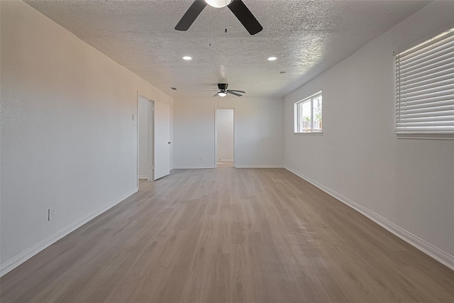 6219 Canada Dr, Pasadena, TX 77505 - unfurnished room featuring a ceiling fan, wood finished floors, a textured ceiling, and recessed lighting