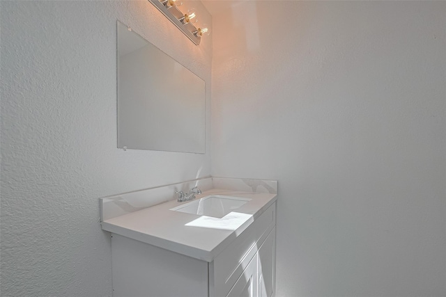 6219 Canada Dr, Pasadena, TX 77505 - bathroom with vanity and a textured wall