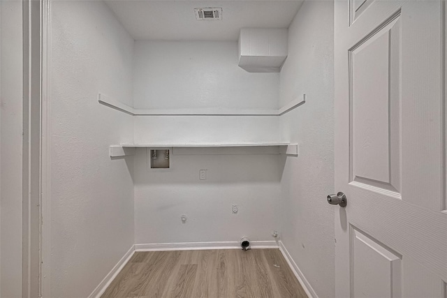 6219 Canada Dr, Pasadena, TX 77505 - washroom with wood finished floors, hookup for a gas dryer, washer hookup, and electric dryer hookup