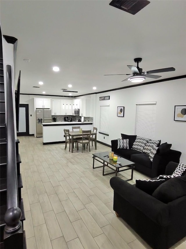 4739 Reed Rd Unit A, Houston, TX 77033 - living area featuring recessed lighting, ceiling fan, and ornamental molding