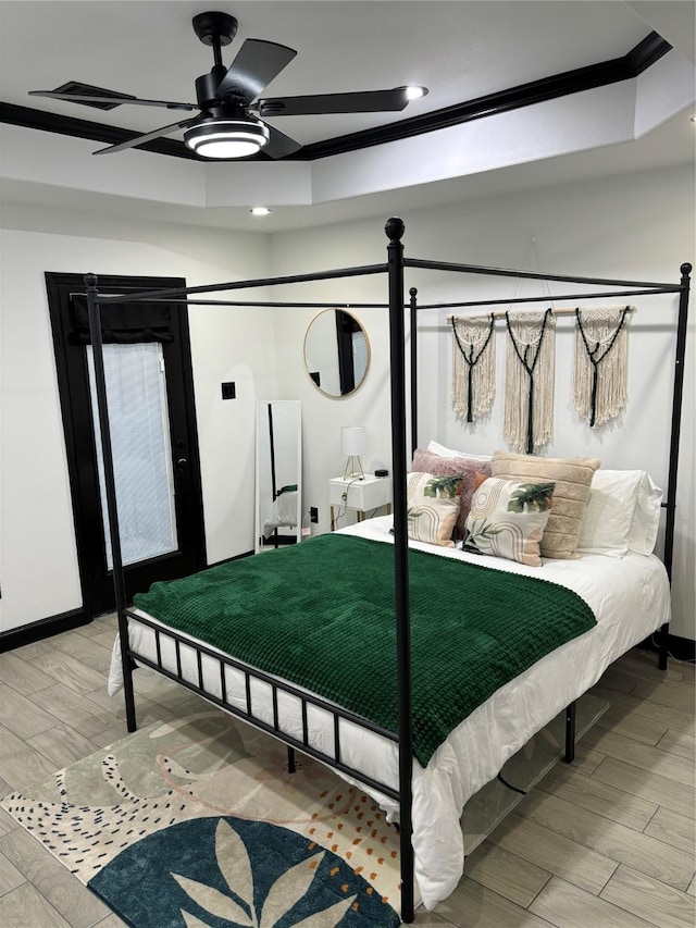 4739 Reed Rd Unit A, Houston, TX 77033 - bedroom featuring ornamental molding, a raised ceiling, light wood-style flooring, recessed lighting, and a ceiling fan
