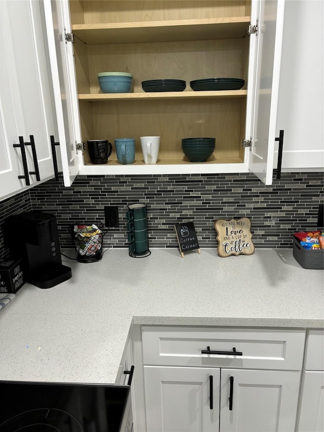 4739 Reed Rd Unit A, Houston, TX 77033 - kitchen view of open shelves, white cabinetry, and tasteful backsplash