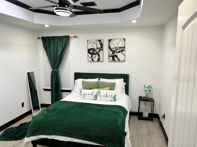 4739 Reed Rd Unit A, Houston, TX 77033 - bedroom with recessed lighting, light wood finished floors, a raised ceiling, and a ceiling fan