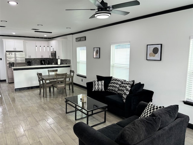 4739 Reed Rd Unit A, Houston, TX 77033 - living area with crown molding, ceiling fan, light wood-style flooring, and recessed lighting