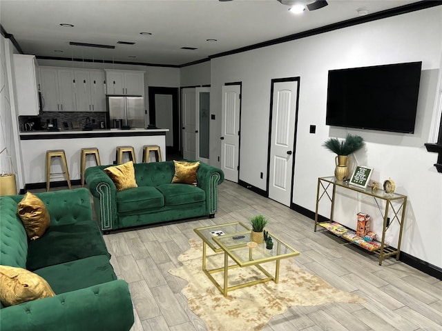 4739 Reed Rd Unit A, Houston, TX 77033 - living room featuring light wood-style flooring and crown molding