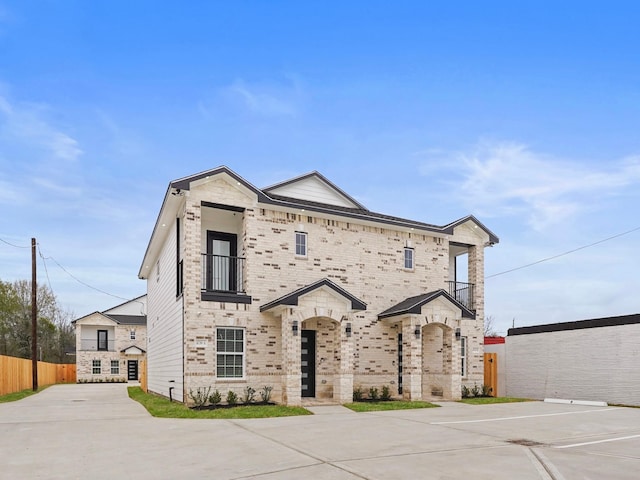 4739 Reed Rd Unit A, Houston, TX 77033 - view of front of property with brick siding and a balcony