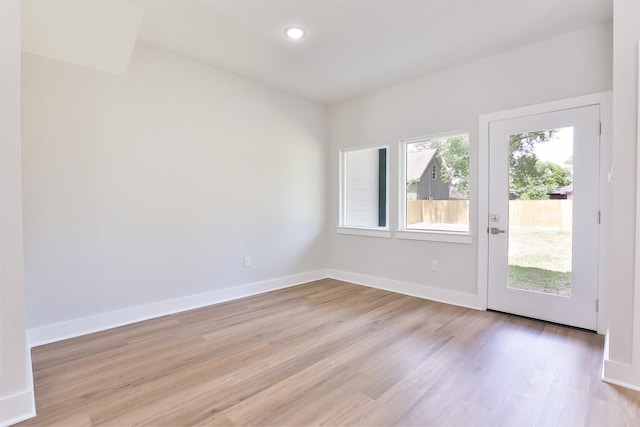6909 S Hall St, Houston, TX 77028 - empty room with light wood-style flooring and recessed lighting