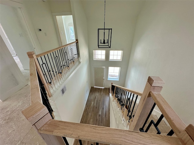 16446 Elk Meadow Dr, Conroe, TX 77302 - stairway with a towering ceiling and wood finished floors