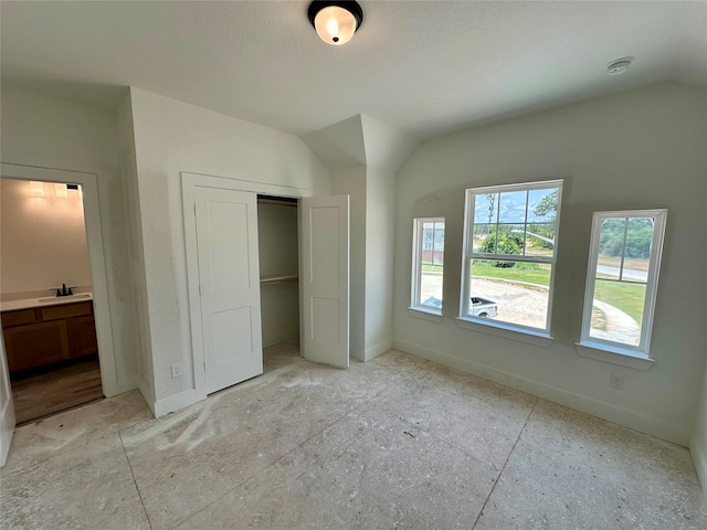 16446 Elk Meadow Dr, Conroe, TX 77302 - unfurnished bedroom with lofted ceiling and a closet