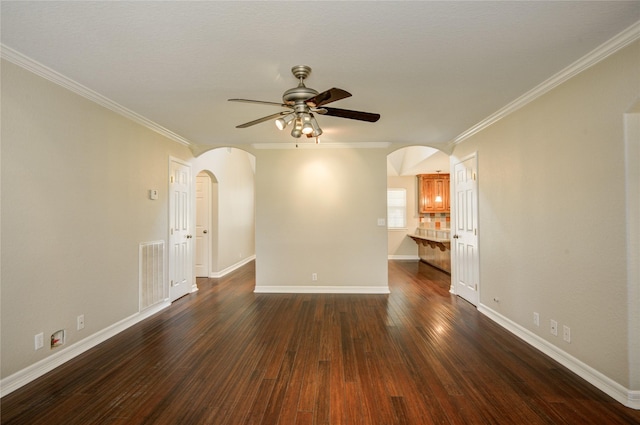 238 Horse Shoe Trl, Angleton, TX 77515 - unfurnished living room with arched walkways, a ceiling fan, crown molding, and dark wood finished floors