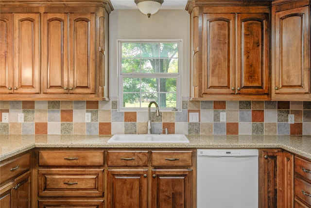 238 Horse Shoe Trl, Angleton, TX 77515 - kitchen featuring dishwasher, brown cabinetry, and tasteful backsplash