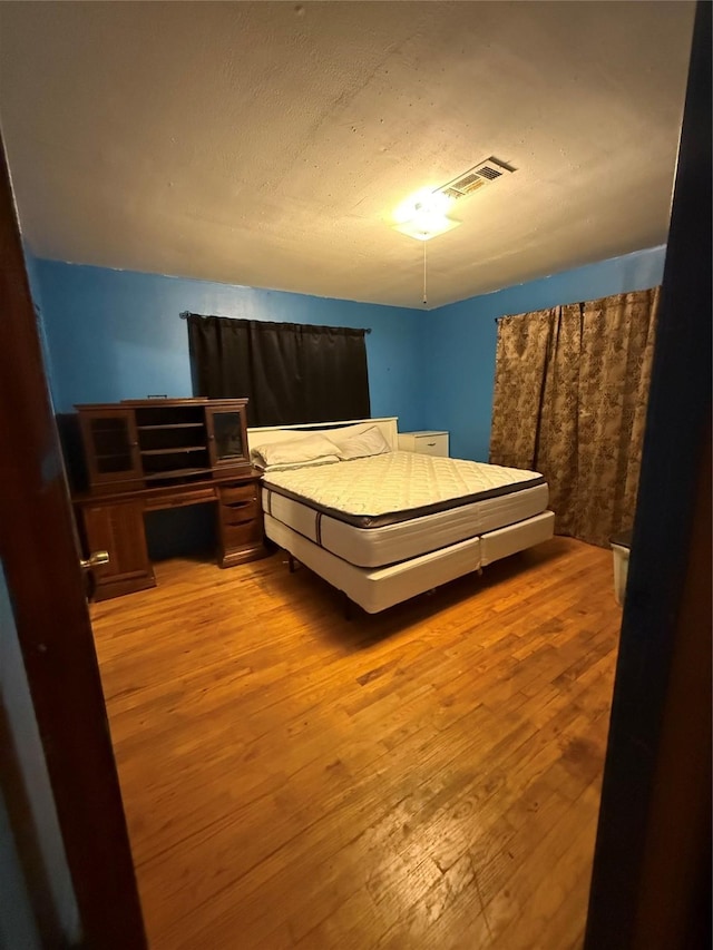 4830 Teton St, Houston, TX 77033 - bedroom featuring hardwood / wood-style flooring