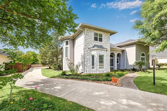 966 Bentwater Dr, Montgomery, TX 77356 - view of front of home with stone siding and stucco siding