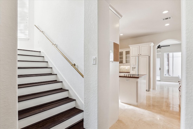 966 Bentwater Dr, Montgomery, TX 77356 - stairs with ceiling fan, tile patterned flooring, arched walkways, and recessed lighting
