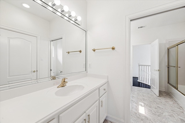 966 Bentwater Dr, Montgomery, TX 77356 - full bath with vanity, marble finish flooring, and bath / shower combo with glass door