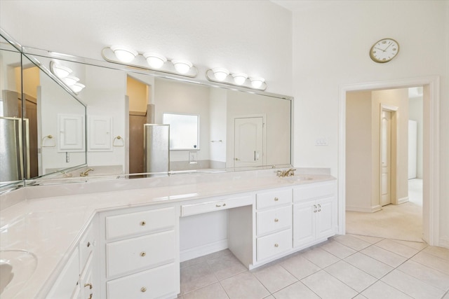 966 Bentwater Dr, Montgomery, TX 77356 - full bathroom featuring double vanity, tile patterned floors, and a shower stall