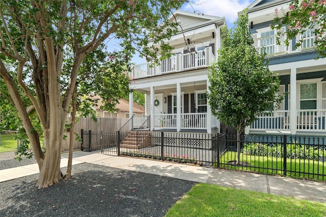 344 W 27th St, Houston, TX 77008 - view of front of property featuring a balcony, a porch, and a fenced front yard