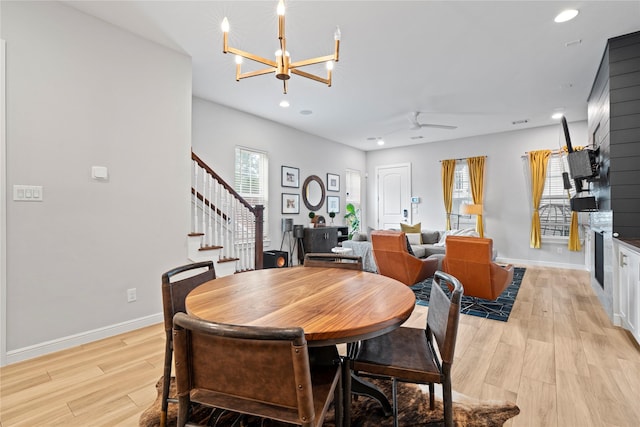 344 W 27th St, Houston, TX 77008 - dining area featuring stairs, recessed lighting, light wood-style floors, and a chandelier