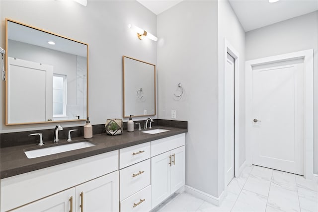 344 W 27th St, Houston, TX 77008 - bathroom with marble look tile flooring, double vanity, and recessed lighting