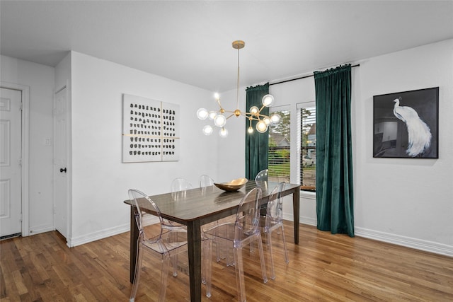 3404 Rosedale St, Houston, TX 77004 - dining space featuring wood finished floors and a chandelier