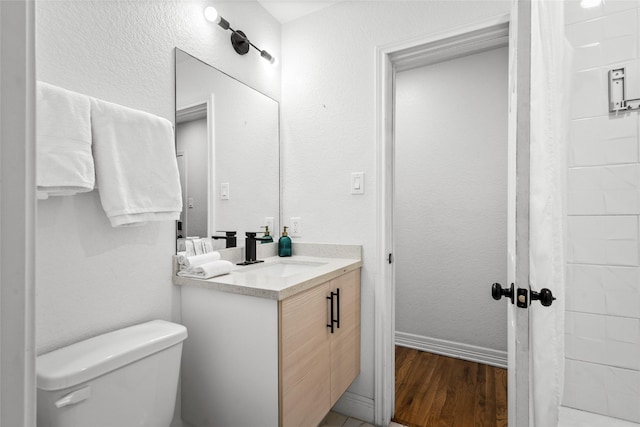 3404 Rosedale St, Houston, TX 77004 - bathroom featuring wood finished floors, vanity, and a shower with shower curtain