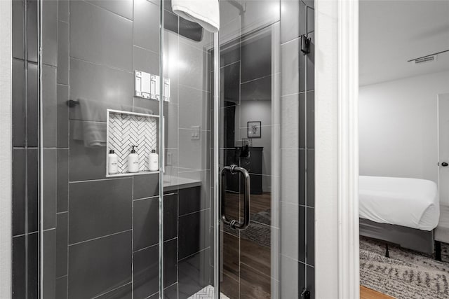 3404 Rosedale St, Houston, TX 77004 - bathroom with wood finished floors, a stall shower, and ensuite bathroom