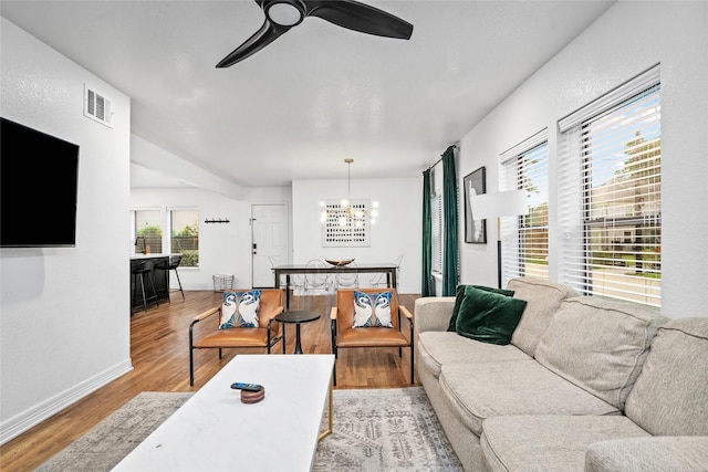 3404 Rosedale St, Houston, TX 77004 - living area featuring a ceiling fan, wood finished floors, and a chandelier