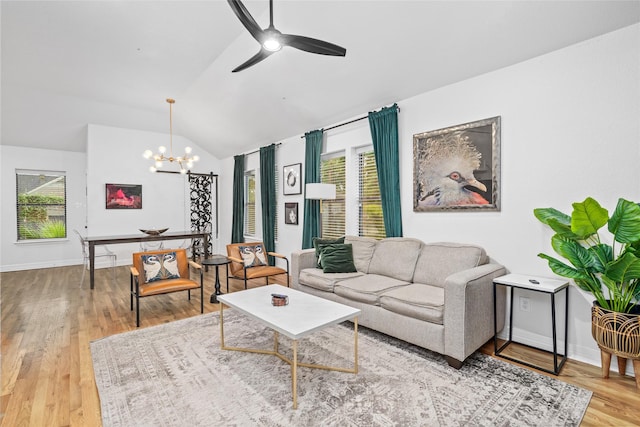 3404 Rosedale St, Houston, TX 77004 - living room featuring wood finished floors, a chandelier, vaulted ceiling, and ceiling fan