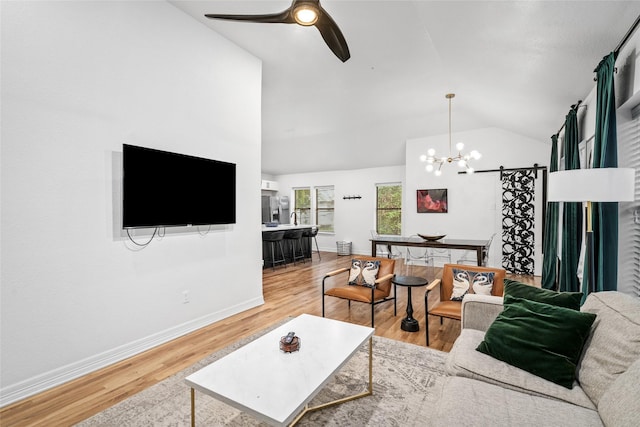 3404 Rosedale St, Houston, TX 77004 - living area featuring vaulted ceiling, a chandelier, a ceiling fan, and light wood-type flooring
