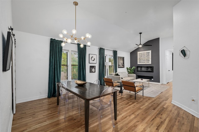 3404 Rosedale St, Houston, TX 77004 - dining area featuring lofted ceiling, a ceiling fan, light wood finished floors, and a chandelier