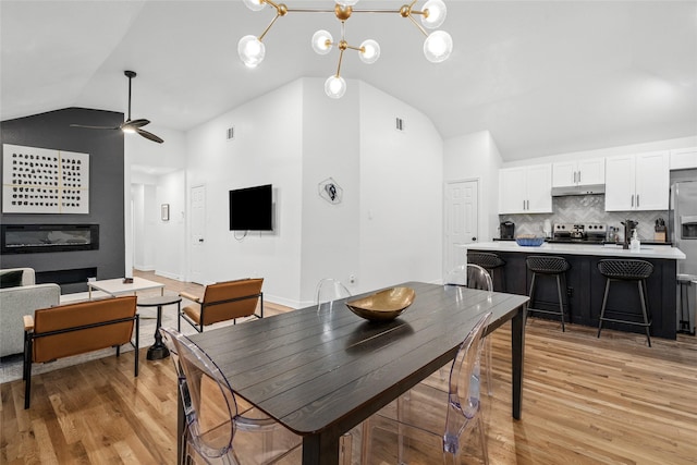 3404 Rosedale St, Houston, TX 77004 - dining area featuring lofted ceiling, light wood finished floors, and a ceiling fan