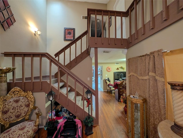 7140 S Dairy Ashford Rd, Houston, TX 77072 - staircase featuring wood finished floors and a high ceiling