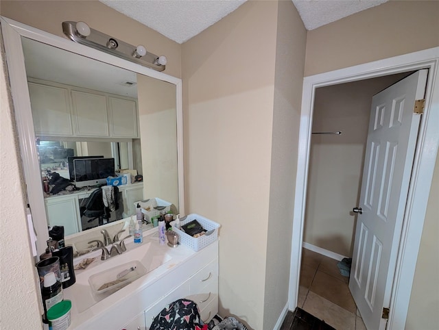 7140 S Dairy Ashford Rd, Houston, TX 77072 - bathroom featuring tile patterned floors, vanity, and a textured ceiling