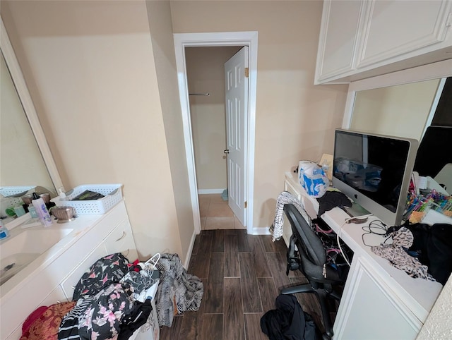 7140 S Dairy Ashford Rd, Houston, TX 77072 - home office with dark wood-style flooring and baseboards