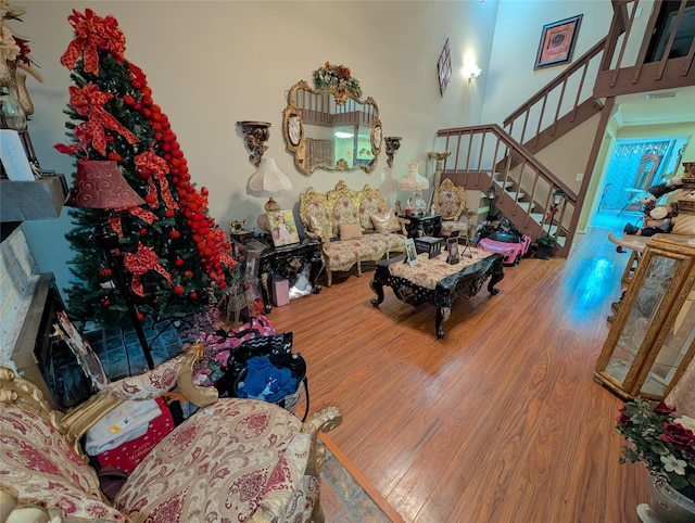 7140 S Dairy Ashford Rd, Houston, TX 77072 - living area with wood finished floors, stairs, and a high ceiling