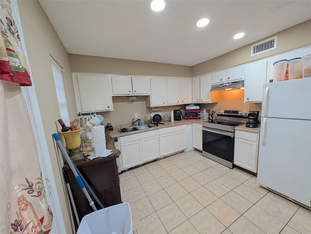 7140 S Dairy Ashford Rd, Houston, TX 77072 - kitchen with freestanding refrigerator, electric stove, under cabinet range hood, white cabinets, and recessed lighting