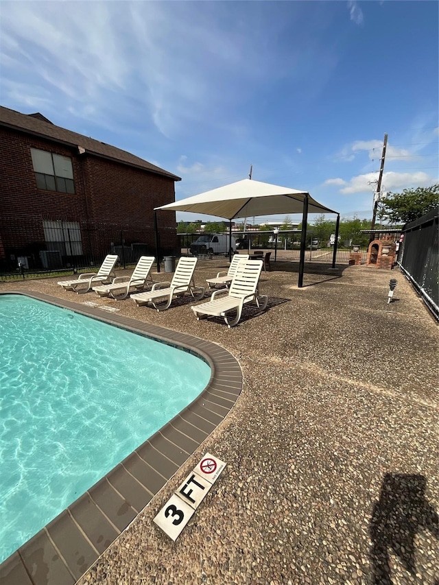 3100 Walnut Bend Ln Unit 113, Houston, TX 77042 - community pool featuring a gazebo