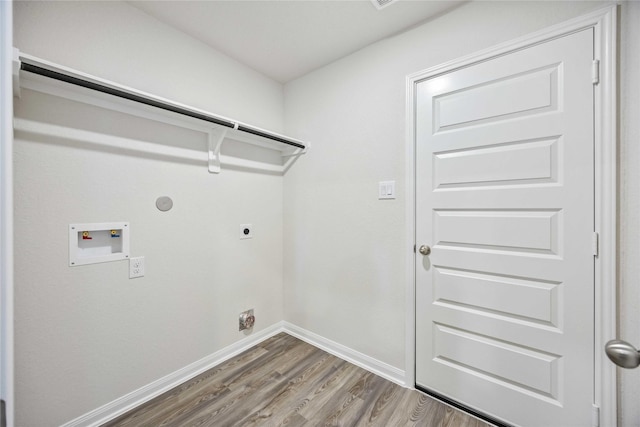 16853 Needlepoint Dr, Conroe, TX 77302 - laundry room featuring electric dryer hookup, washer hookup, wood finished floors, and gas dryer hookup