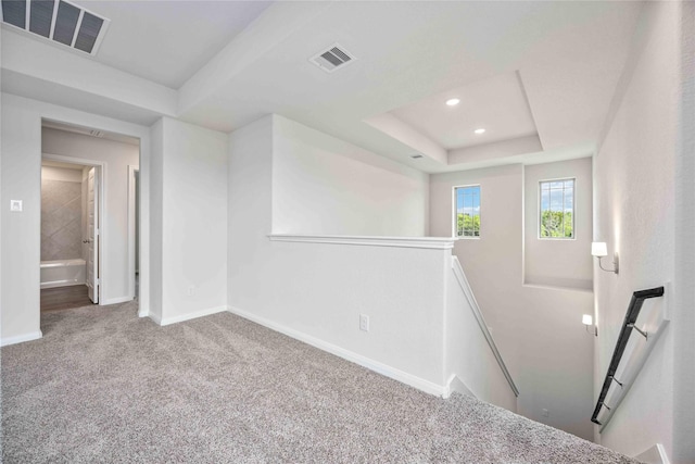 16853 Needlepoint Dr, Conroe, TX 77302 - carpeted spare room featuring a raised ceiling and recessed lighting