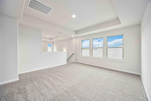 16853 Needlepoint Dr, Conroe, TX 77302 - unfurnished room featuring carpet floors, a raised ceiling, healthy amount of natural light, and recessed lighting